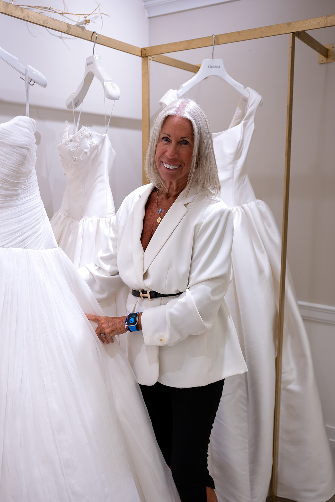 Lace wedding gown detail during the Nicole and Felicia Kleinfeld event