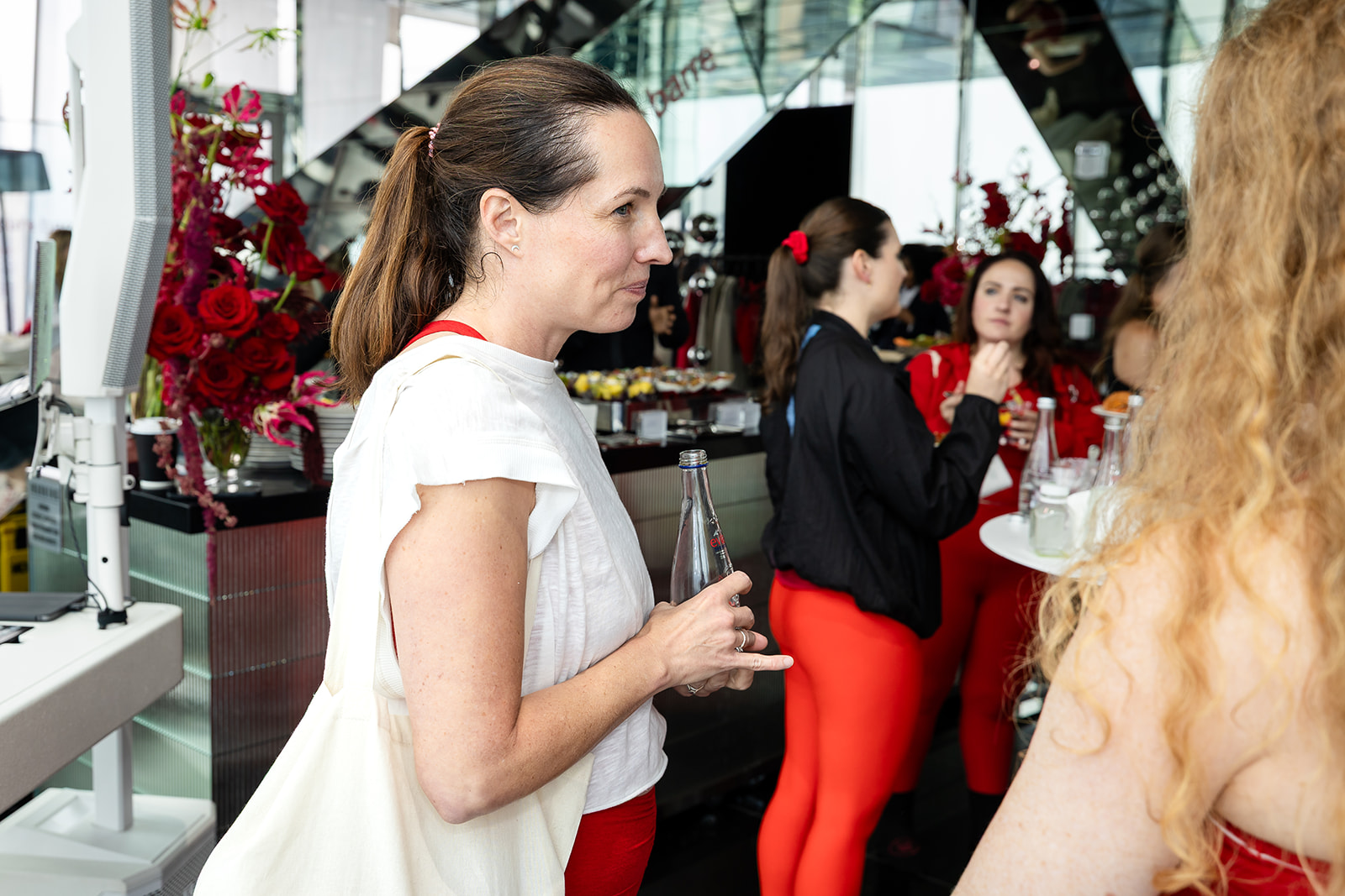 Guest visiting a beauty partner activation during the Pure Barre event